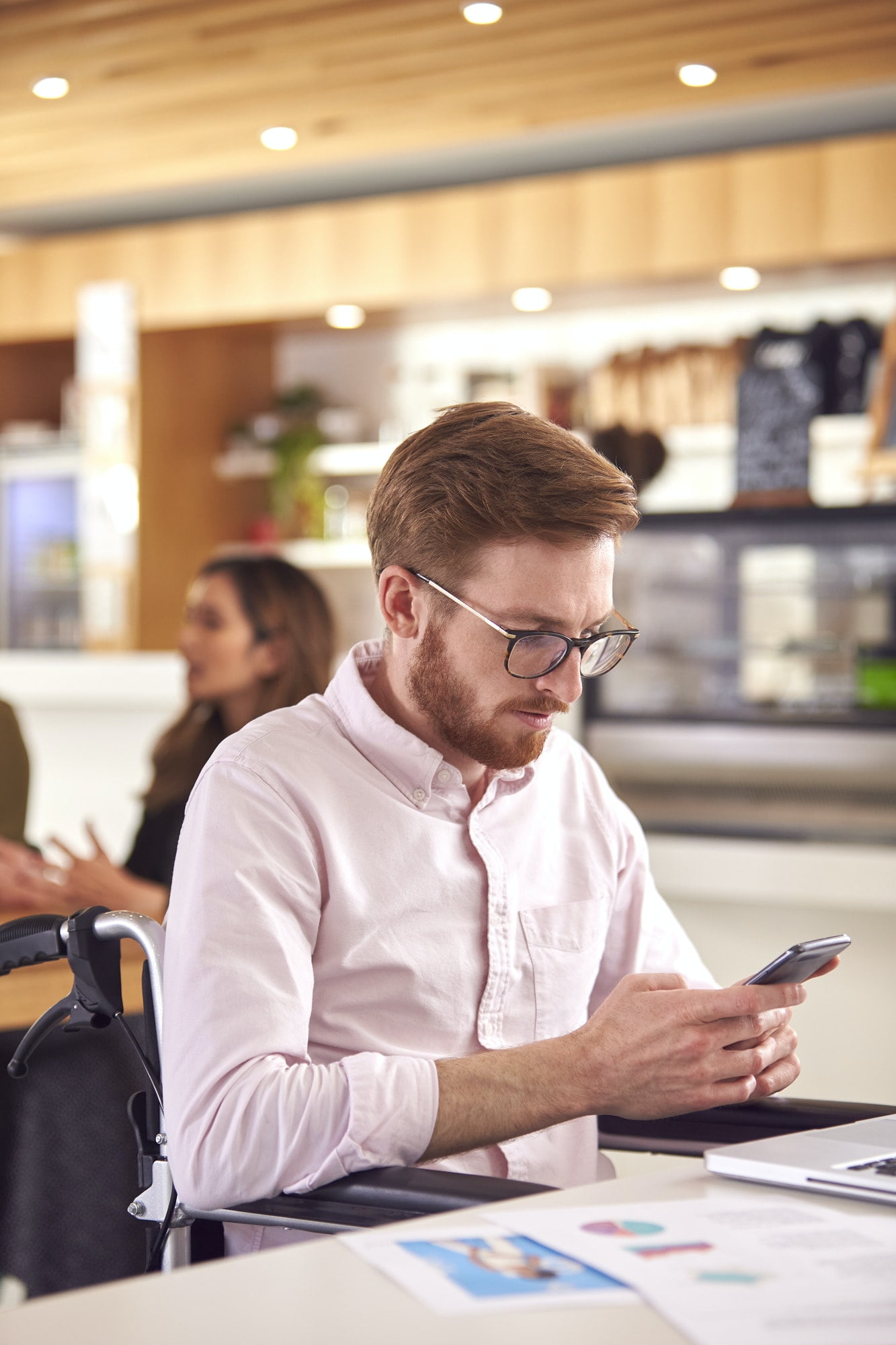 Business man working in a coffee shop with phone