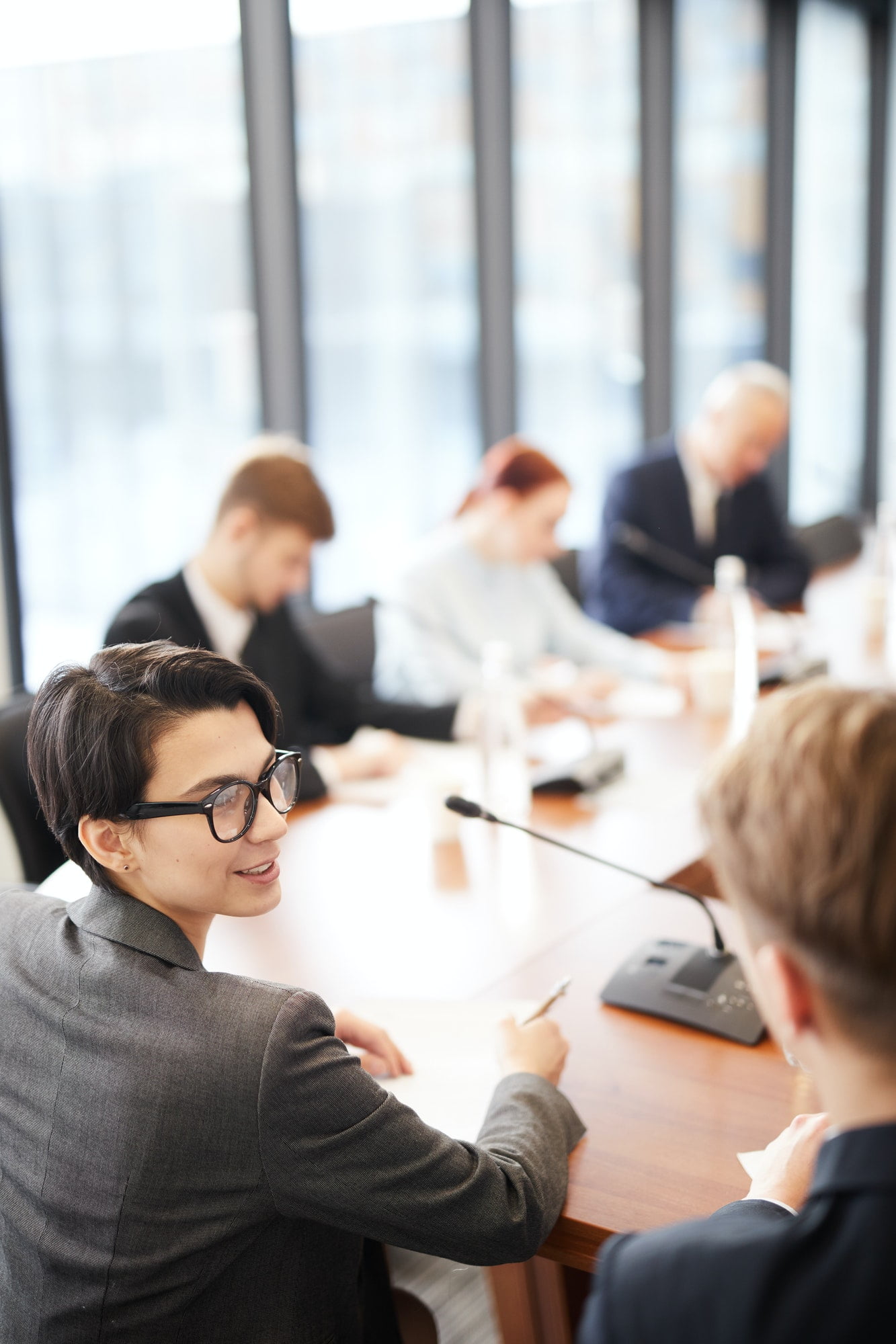 Multiple office Workers in Business Meeting talking
