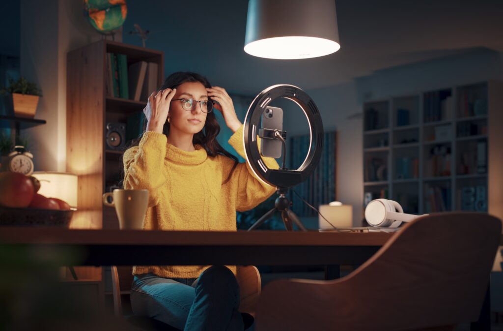 Woman recording a video in front of selfie camera